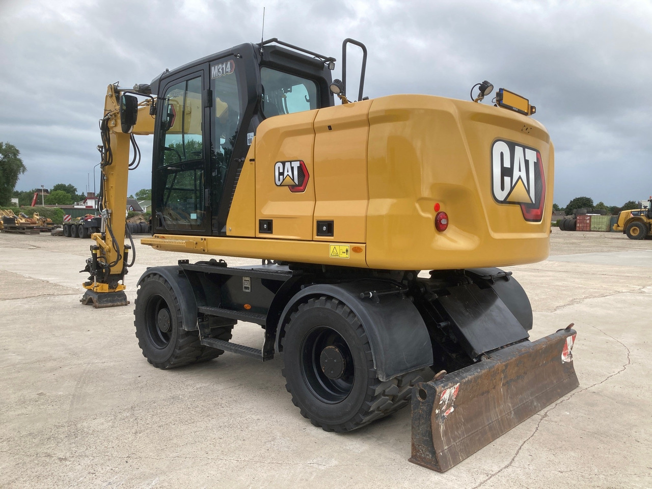 CATERPILLAR M314 - Riteņu ekskavators: foto 1 CATERPILLAR M314 - Riteņu ekskavators: foto 1