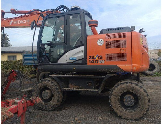 Hitachi Zaxis 140W-5B - Riteņu ekskavators: foto 1 Hitachi Zaxis 140W-5B - Riteņu ekskavators: foto 1