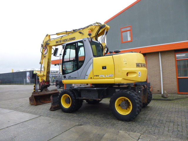 NEW HOLLAND MH PLUS - Riteņu ekskavators: foto 3 NEW HOLLAND MH PLUS - Riteņu ekskavators: foto 3