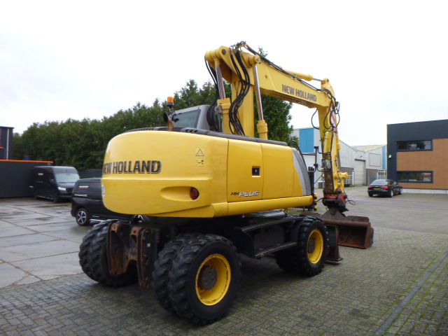 NEW HOLLAND MH PLUS - Riteņu ekskavators: foto 5 NEW HOLLAND MH PLUS - Riteņu ekskavators: foto 5