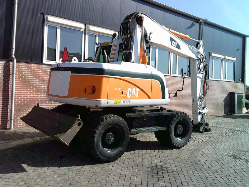 Caterpillar M313D - Riteņu ekskavators: foto 4 Caterpillar M313D - Riteņu ekskavators: foto 4