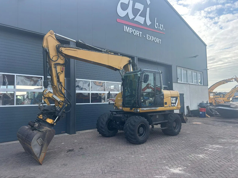 Caterpillar M313D - Riteņu ekskavators: foto 1 Caterpillar M313D - Riteņu ekskavators: foto 1