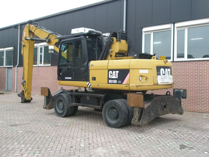 Caterpillar M318D - Riteņu ekskavators: foto 2 Caterpillar M318D - Riteņu ekskavators: foto 2