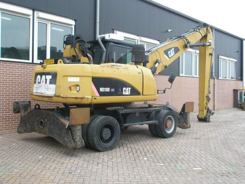 Caterpillar M318D - Riteņu ekskavators: foto 4 Caterpillar M318D - Riteņu ekskavators: foto 4