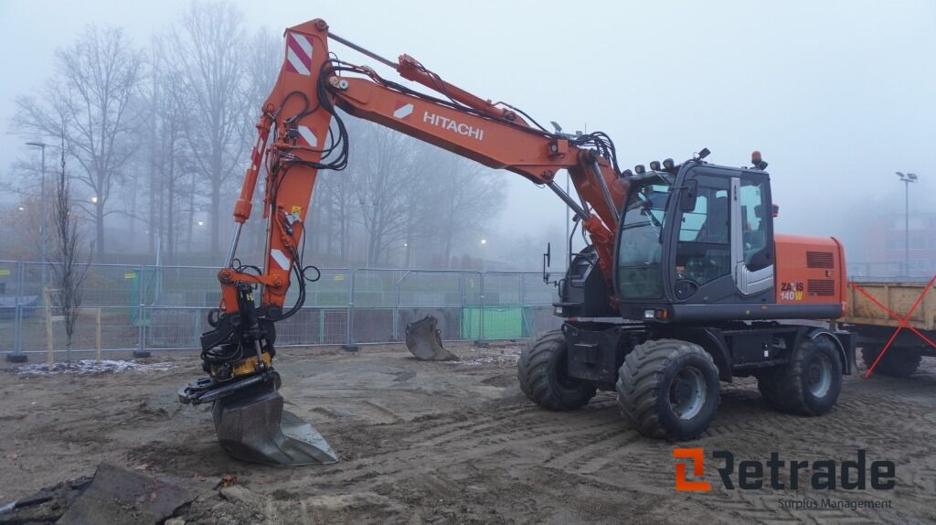 Hjulgrävare Hitachi ZX 140W-3 - Riteņu ekskavators: foto 1 Hjulgrävare Hitachi ZX 140W-3 - Riteņu ekskavators: foto 1
