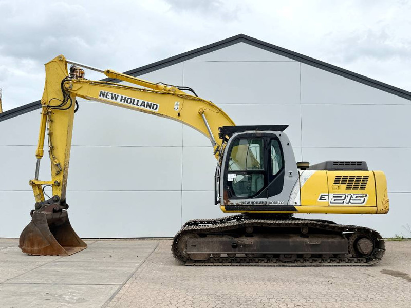 New Holland E215LC - German Machine / Hammer Lines - Kāpurķēžu ekskavators: foto 1 New Holland E215LC - German Machine / Hammer Lines - Kāpurķēžu ekskavators: foto 1
