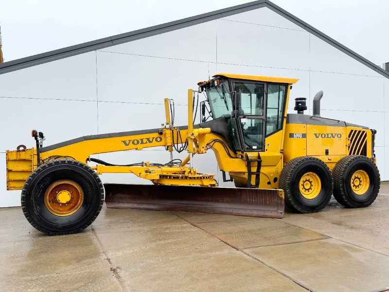 Volvo G990 - 4.85m Blade / Pushblock / Airco - Greiders: foto 1 Volvo G990 - 4.85m Blade / Pushblock / Airco - Greiders: foto 1