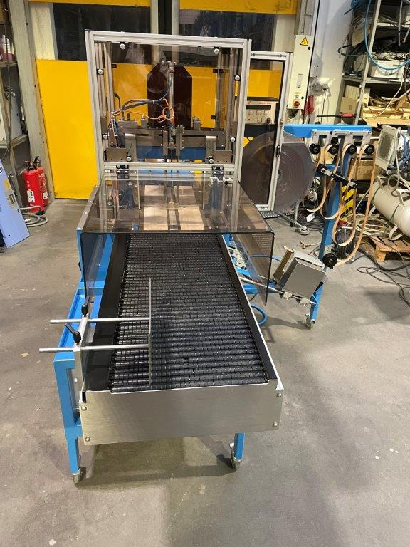 ATS Tanner UltraSonic US 2000-AB transit banding machine with pneumatic product hold-down and infeed roller table - Iepakošanas mašīna: foto 4 ATS Tanner UltraSonic US 2000-AB transit banding machine with pneumatic product hold-down and infeed roller table - Iepakošanas mašīna: foto 4