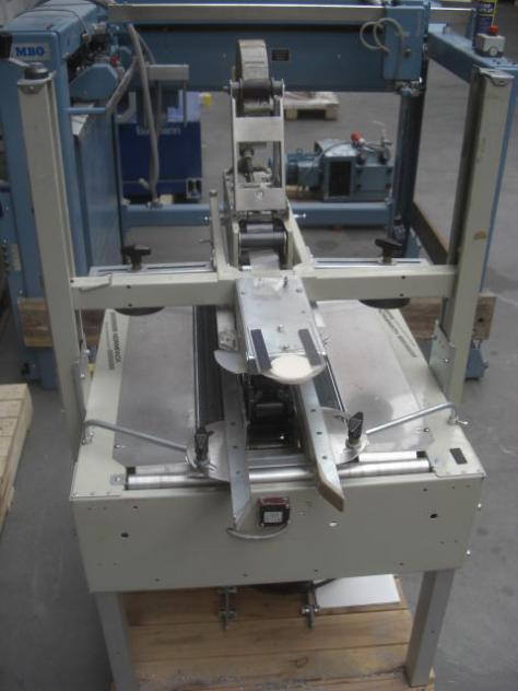 Normpack Tapemat NCG 320 automatic folding carton sealing machine - Iepakošanas mašīna: foto 4 Normpack Tapemat NCG 320 automatic folding carton sealing machine - Iepakošanas mašīna: foto 4