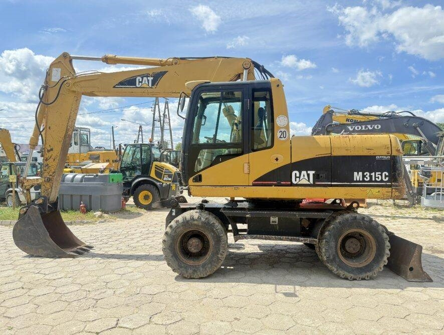 CAT M315C - Riteņu ekskavators: foto 1 CAT M315C - Riteņu ekskavators: foto 1