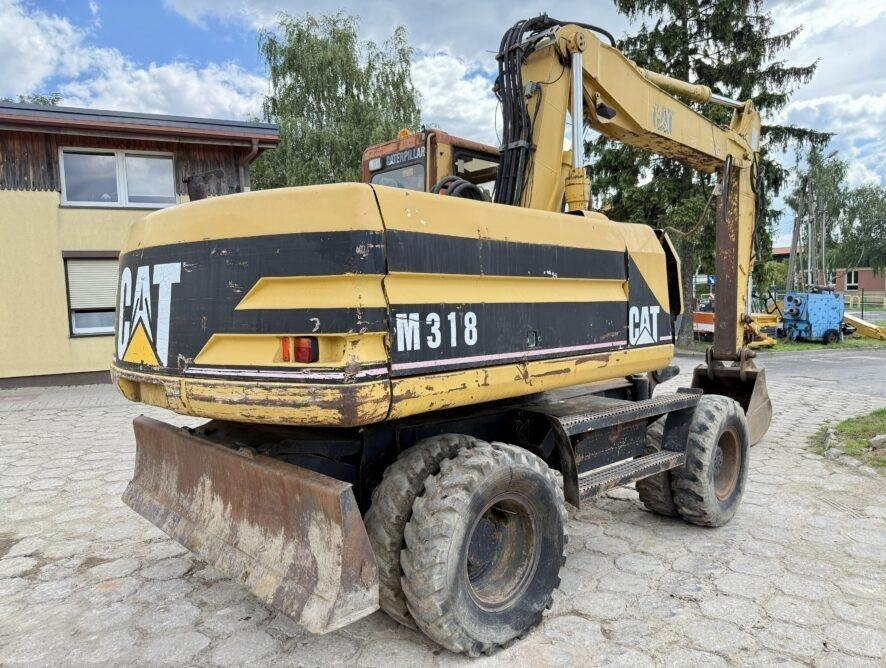 CAT M318 - Riteņu ekskavators: foto 1 CAT M318 - Riteņu ekskavators: foto 1