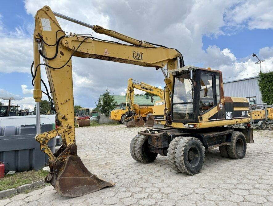 CAT M318 - Riteņu ekskavators: foto 2 CAT M318 - Riteņu ekskavators: foto 2