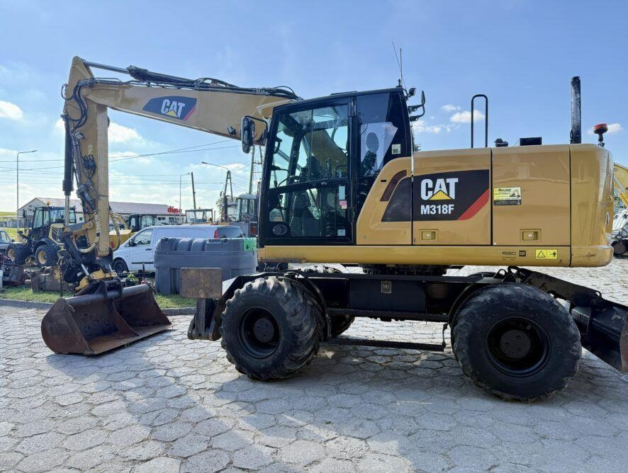 CAT M318F - Riteņu ekskavators: foto 1 CAT M318F - Riteņu ekskavators: foto 1