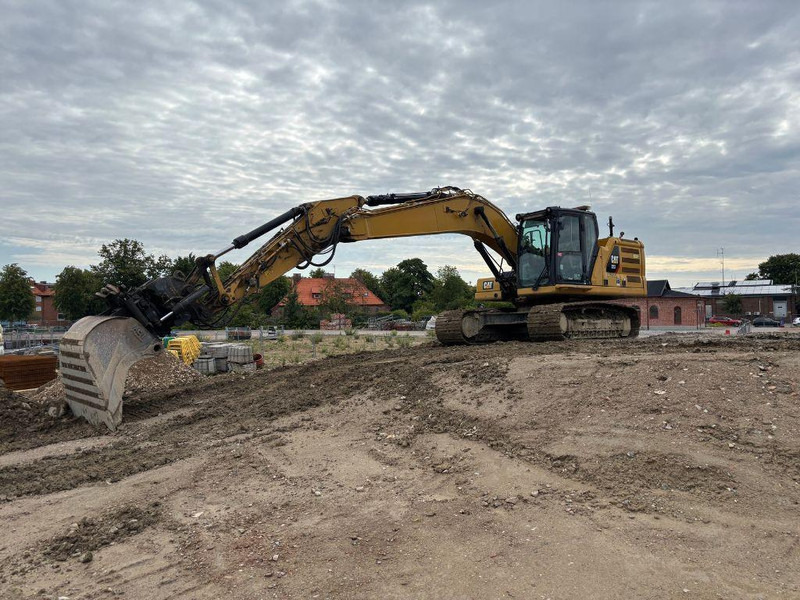 Caterpillar 323 - Kāpurķēžu ekskavators: foto 1 Caterpillar 323 - Kāpurķēžu ekskavators: foto 1