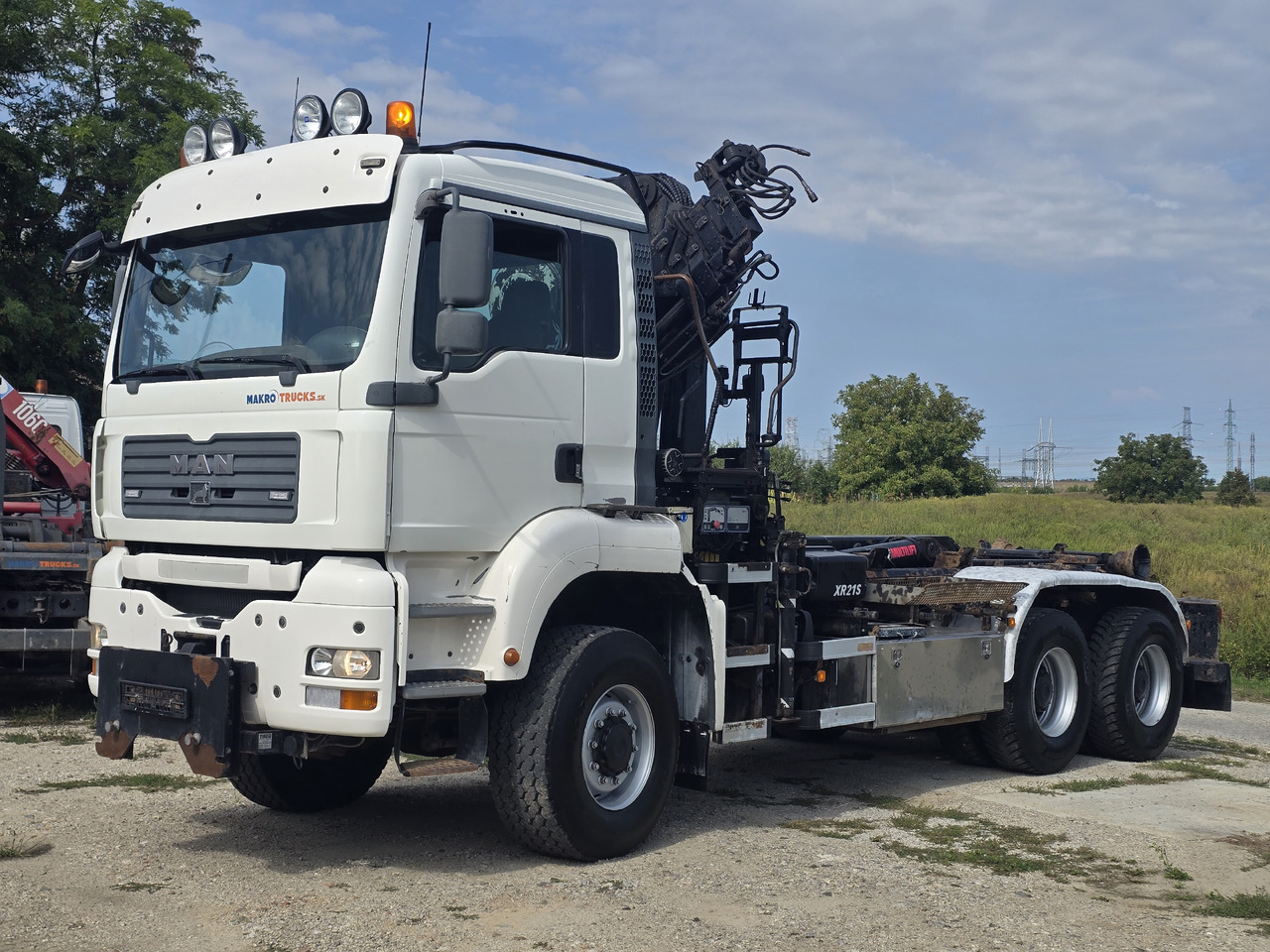 MAN TGA 26.440 6X6 / HOOK SYSTEM / HIAB 166D REMOTE SPECIAL PRICE ONLY THIS YEAR - Pacēlājs ar āķi, Kravas auto ar manipulatoru: foto 1 MAN TGA 26.440 6X6 / HOOK SYSTEM / HIAB 166D REMOTE SPECIAL PRICE ONLY THIS YEAR - Pacēlājs ar āķi, Kravas auto ar manipulatoru: foto 1