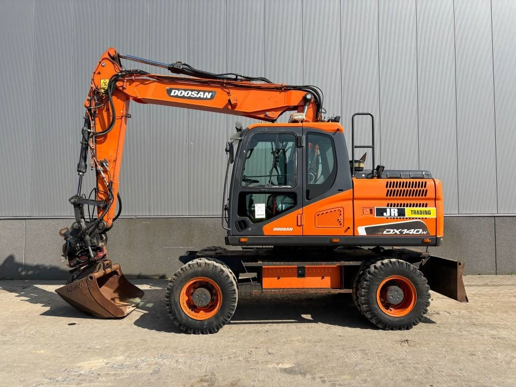 Doosan DX 140 W-5 (R5 Rototilt) - Riteņu ekskavators: foto 1 Doosan DX 140 W-5 (R5 Rototilt) - Riteņu ekskavators: foto 1