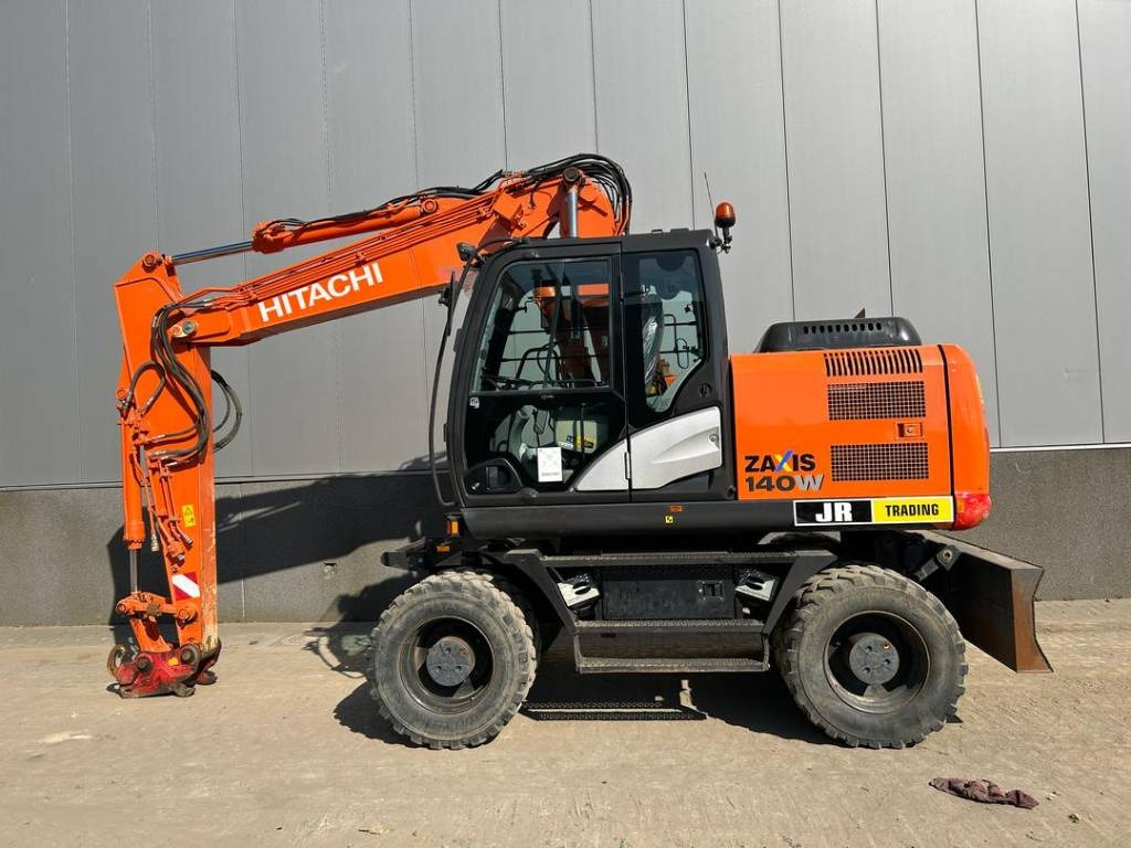 Hitachi ZX 140 W-5B - Riteņu ekskavators: foto 1 Hitachi ZX 140 W-5B - Riteņu ekskavators: foto 1