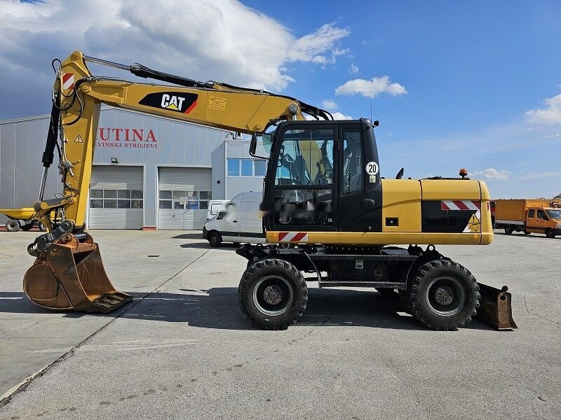 Caterpillar M315D - Riteņu ekskavators: foto 1 Caterpillar M315D - Riteņu ekskavators: foto 1