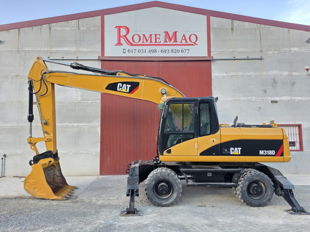 CAT M318D - Riteņu ekskavators: foto 1 CAT M318D - Riteņu ekskavators: foto 1