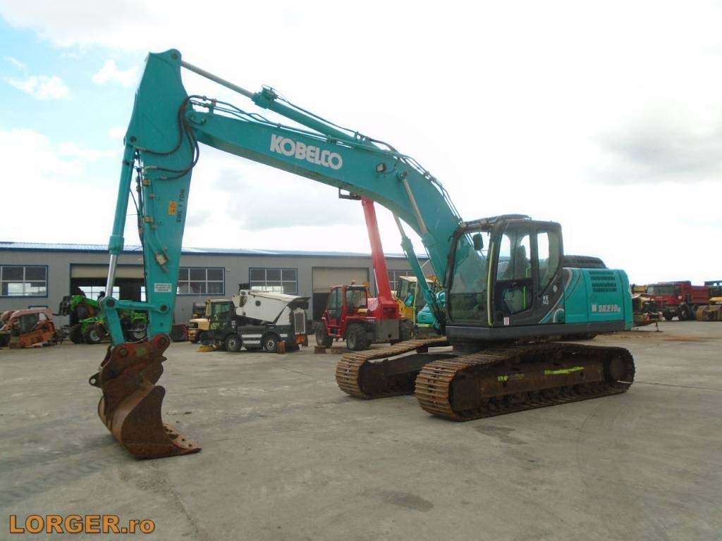 Kobelco SK 210 LC-10 - Kāpurķēžu ekskavators: foto 1 Kobelco SK 210 LC-10 - Kāpurķēžu ekskavators: foto 1