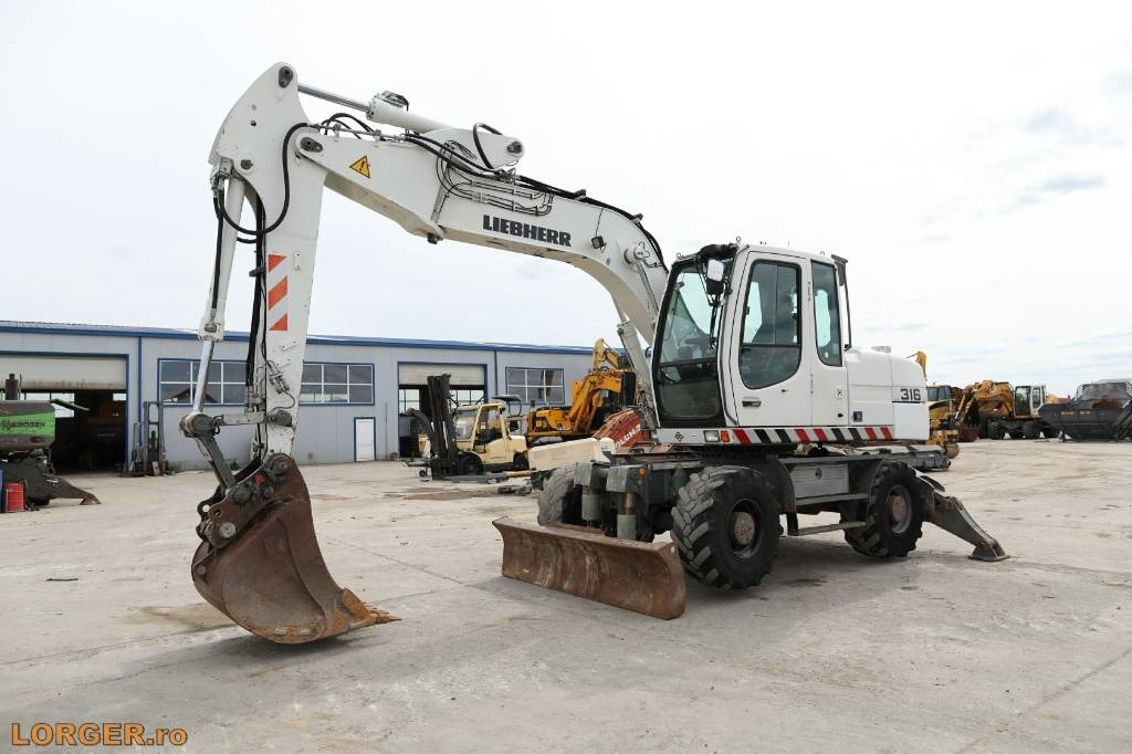 Liebherr A 316 Litronic - Riteņu ekskavators: foto 5 Liebherr A 316 Litronic - Riteņu ekskavators: foto 5