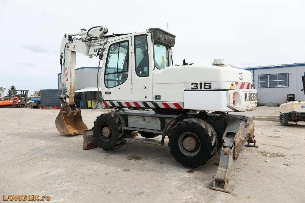 Liebherr A 316 Litronic - Riteņu ekskavators: foto 3 Liebherr A 316 Litronic - Riteņu ekskavators: foto 3