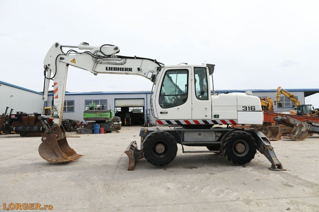 Liebherr A 316 Litronic - Riteņu ekskavators: foto 4 Liebherr A 316 Litronic - Riteņu ekskavators: foto 4