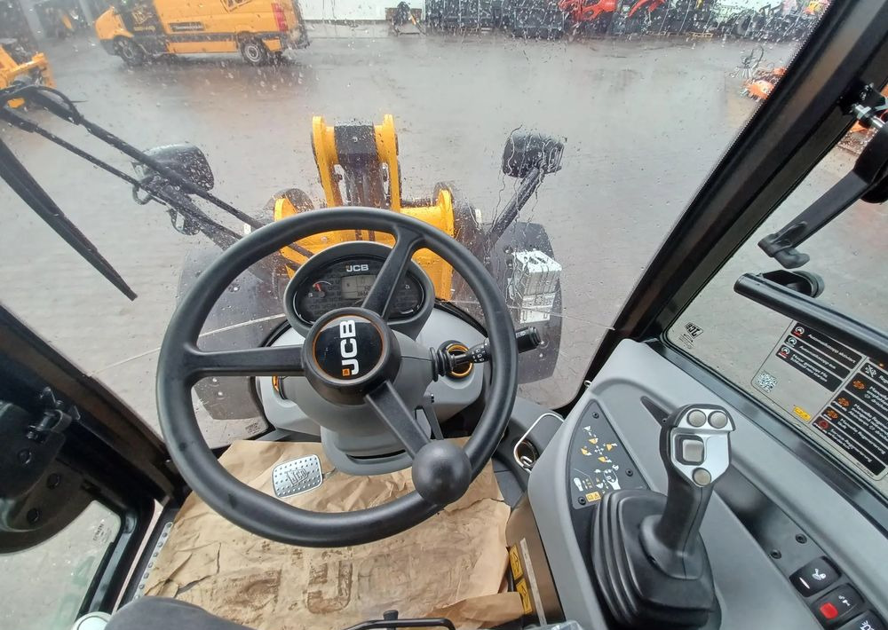 Riteņu iekrāvējs JCB 409: foto 7