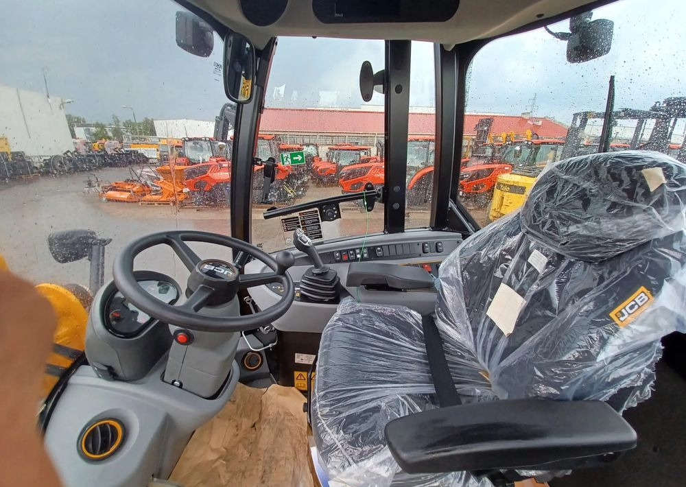 Riteņu iekrāvējs JCB 409: foto 8