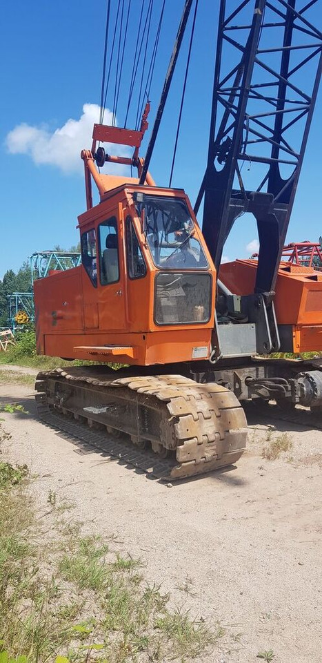 Hitachi KH-100 - Kāpurķēžu celtnis: foto 1 Hitachi KH-100 - Kāpurķēžu celtnis: foto 1