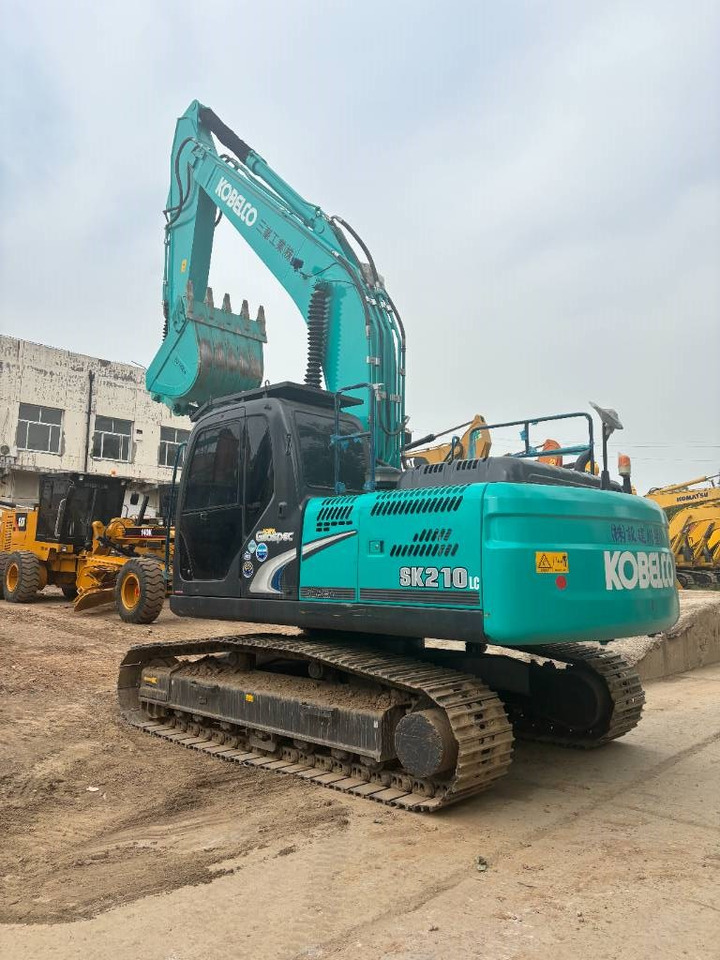 Kobelco SK 210 - Kāpurķēžu ekskavators: foto 5 Kobelco SK 210 - Kāpurķēžu ekskavators: foto 5