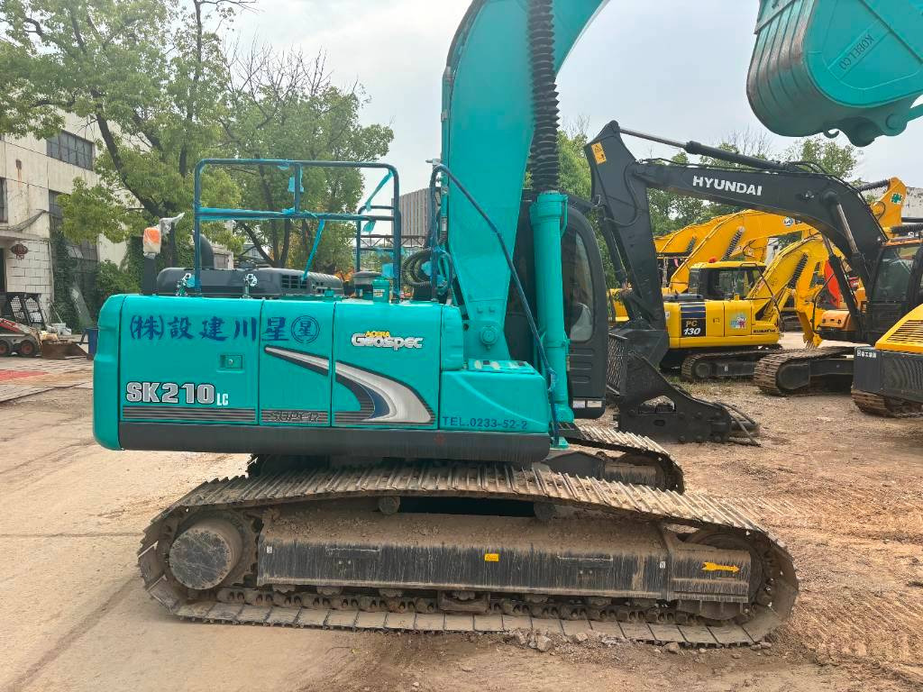 Kāpurķēžu ekskavators Kobelco SK 210: foto 14