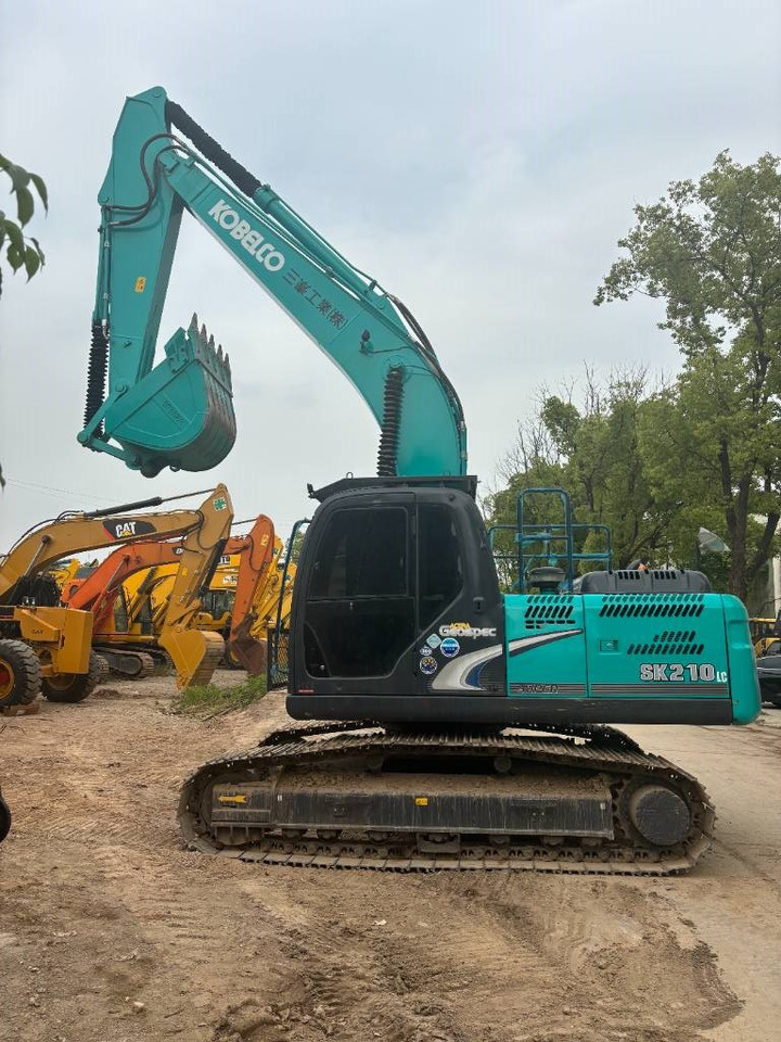 Kobelco SK 210 - Kāpurķēžu ekskavators: foto 1 Kobelco SK 210 - Kāpurķēžu ekskavators: foto 1