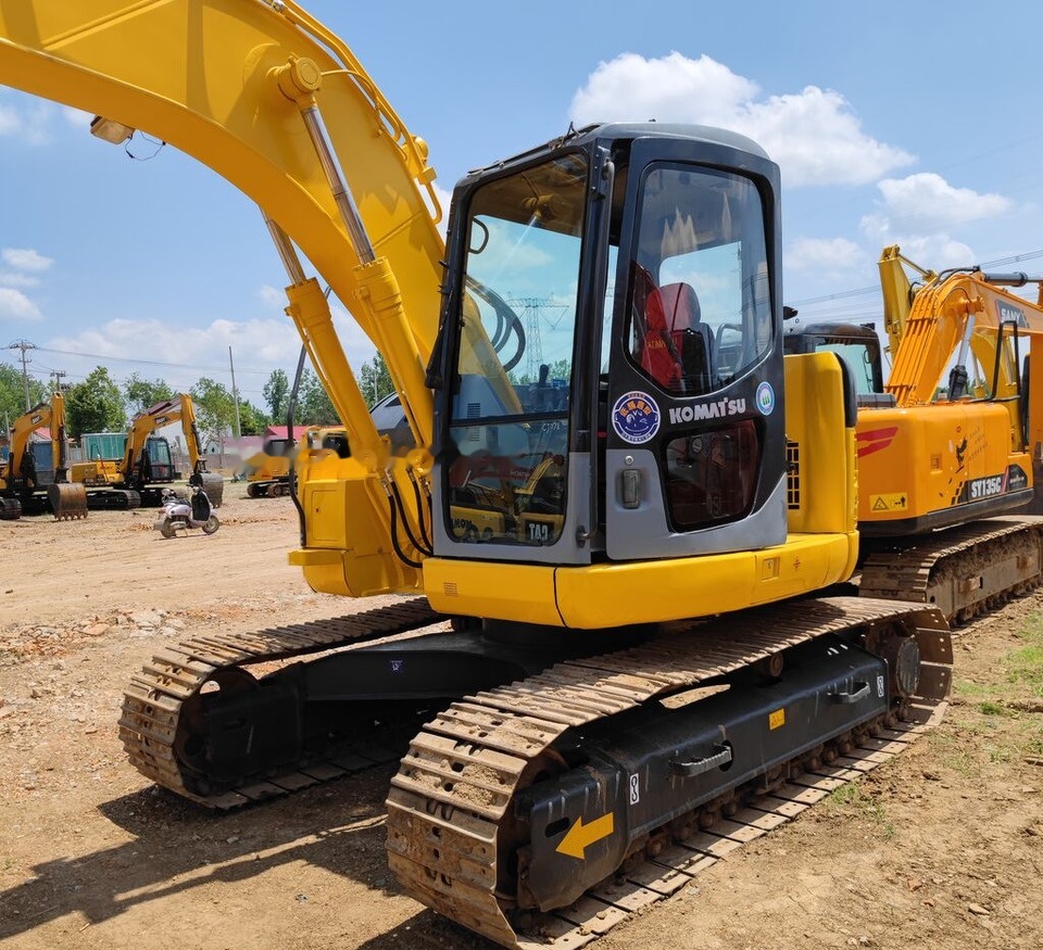 Komatsu PC128US - Kāpurķēžu ekskavators: foto 1 Komatsu PC128US - Kāpurķēžu ekskavators: foto 1