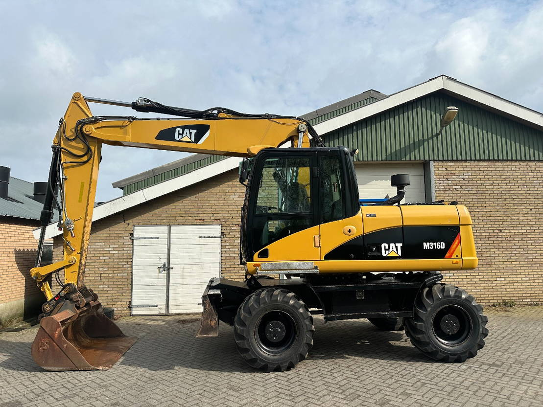 Caterpillar M316D - Riteņu ekskavators: foto 1 Caterpillar M316D - Riteņu ekskavators: foto 1