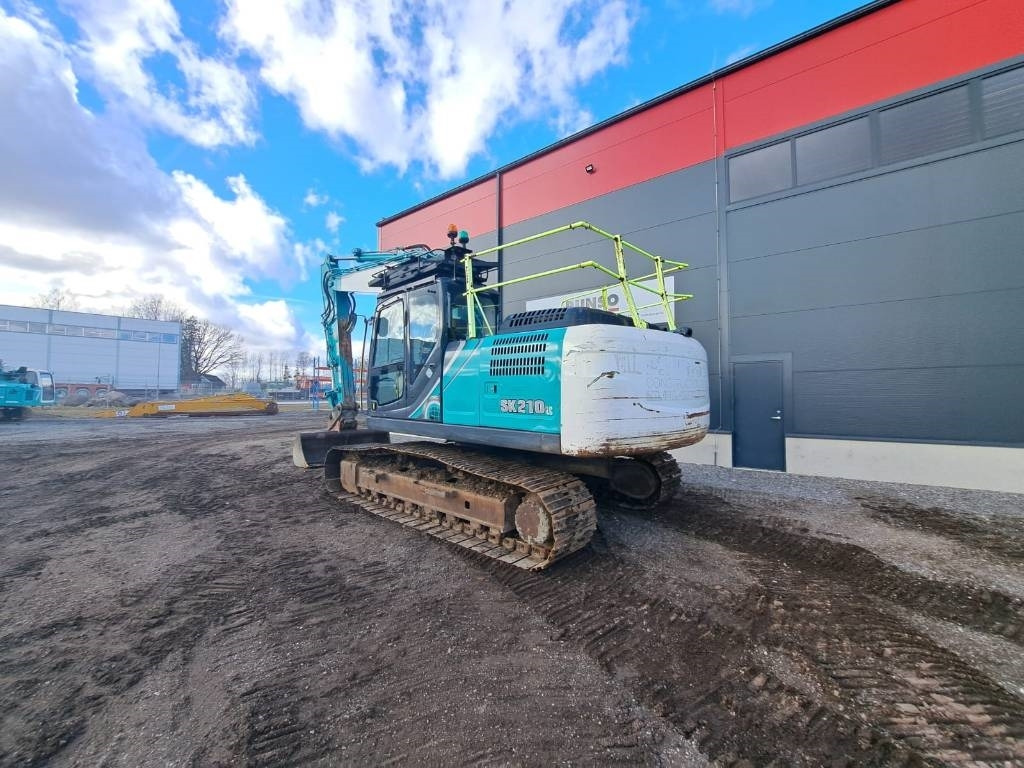 Kobelco SK 210 LC-10E - Kāpurķēžu ekskavators: foto 3 Kobelco SK 210 LC-10E - Kāpurķēžu ekskavators: foto 3