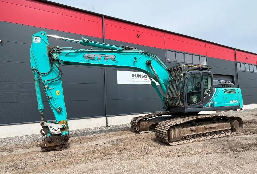 Kobelco SK300LC-10 - Kāpurķēžu ekskavators: foto 1 Kobelco SK300LC-10 - Kāpurķēžu ekskavators: foto 1