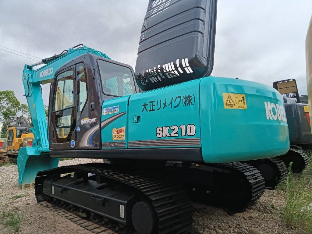 Kobelco SK 210 - Kāpurķēžu ekskavators: foto 1 Kobelco SK 210 - Kāpurķēžu ekskavators: foto 1