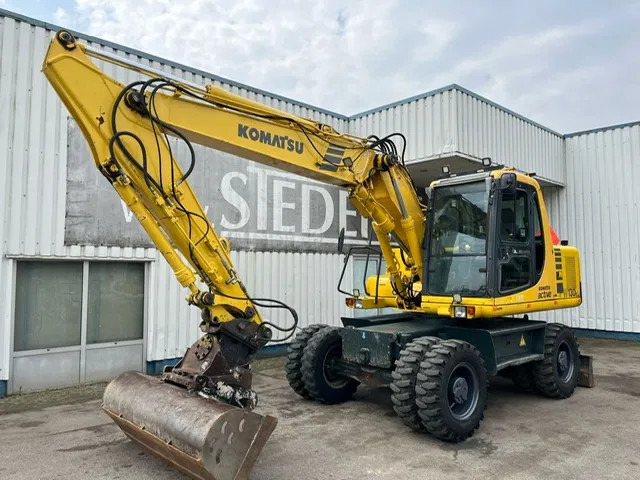 Komatsu PW 130 ES-6K , Wheel Excavator - Riteņu ekskavators: foto 1 Komatsu PW 130 ES-6K , Wheel Excavator - Riteņu ekskavators: foto 1