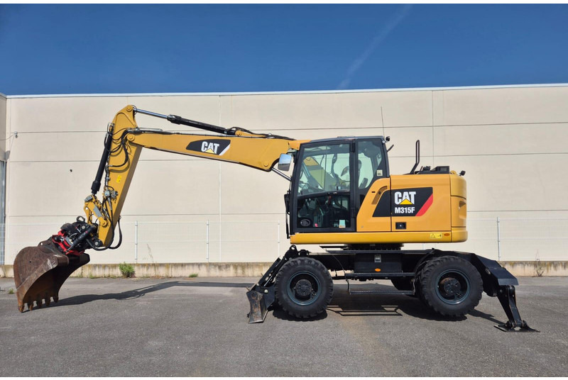 Caterpillar M315F - Riteņu ekskavators: foto 1 Caterpillar M315F - Riteņu ekskavators: foto 1