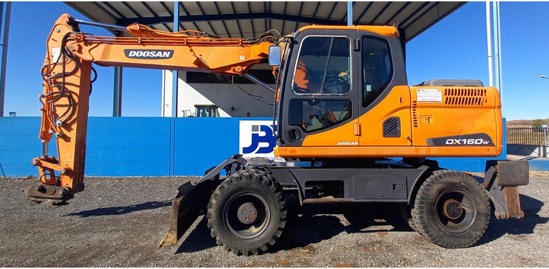 Doosan DX140W-3 - Riteņu ekskavators: foto 1 Doosan DX140W-3 - Riteņu ekskavators: foto 1