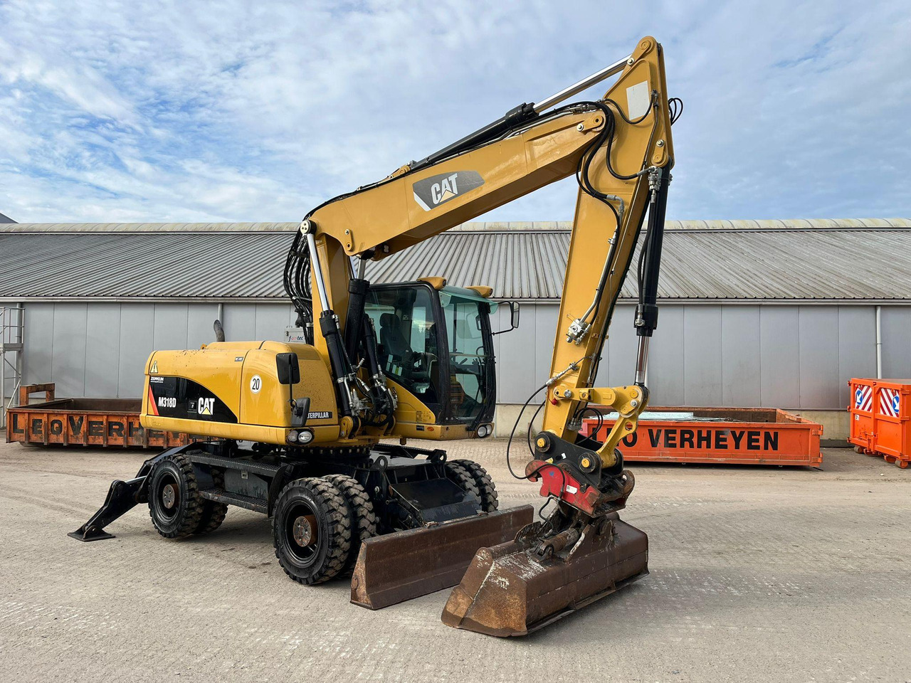 Caterpillar M318D - Riteņu ekskavators: foto 1 Caterpillar M318D - Riteņu ekskavators: foto 1