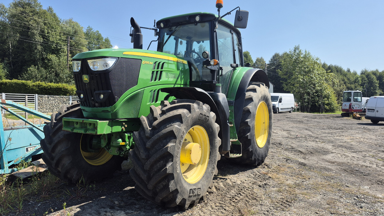 JOHN DEERE 6195M - Traktors: foto 1 JOHN DEERE 6195M - Traktors: foto 1