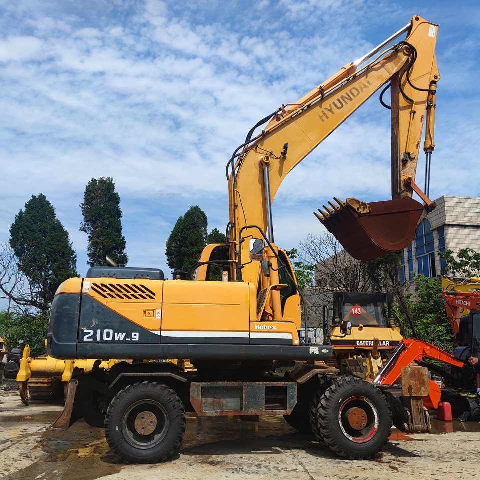Hyundai 210w-9 wheel excavator - Riteņu ekskavators: foto 2 Hyundai 210w-9 wheel excavator - Riteņu ekskavators: foto 2