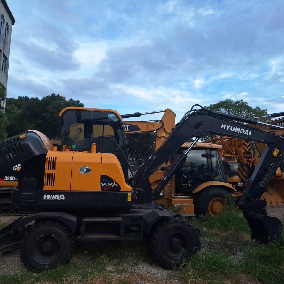 Hyundai HW60  excavator - Riteņu ekskavators: foto 1 Hyundai HW60  excavator - Riteņu ekskavators: foto 1