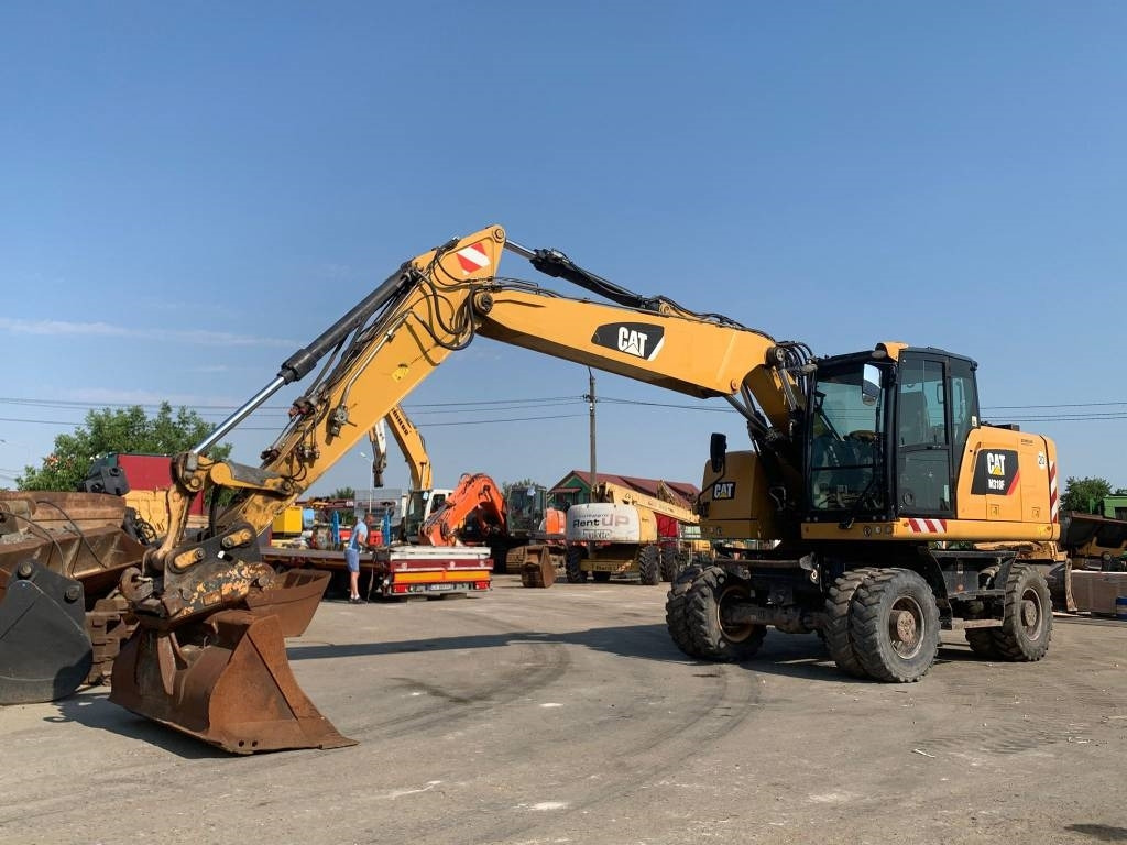 CAT M 318 F - Riteņu ekskavators: foto 1 CAT M 318 F - Riteņu ekskavators: foto 1