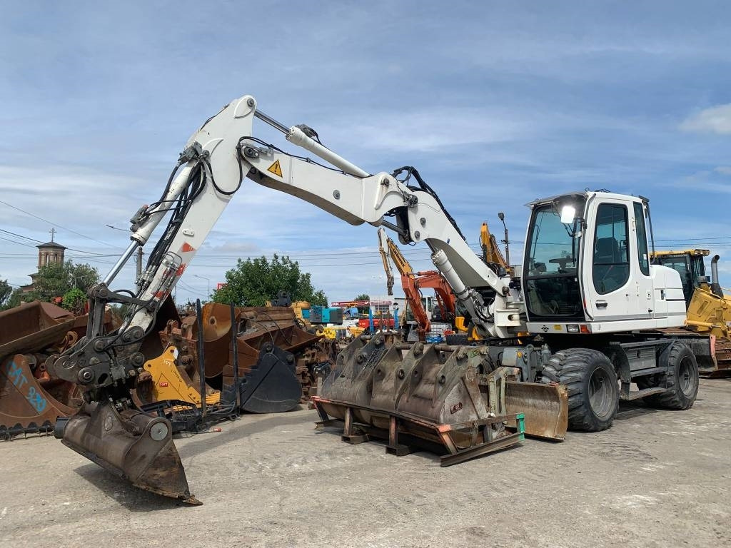 Liebherr A 311 Litronic - Riteņu ekskavators: foto 1 Liebherr A 311 Litronic - Riteņu ekskavators: foto 1