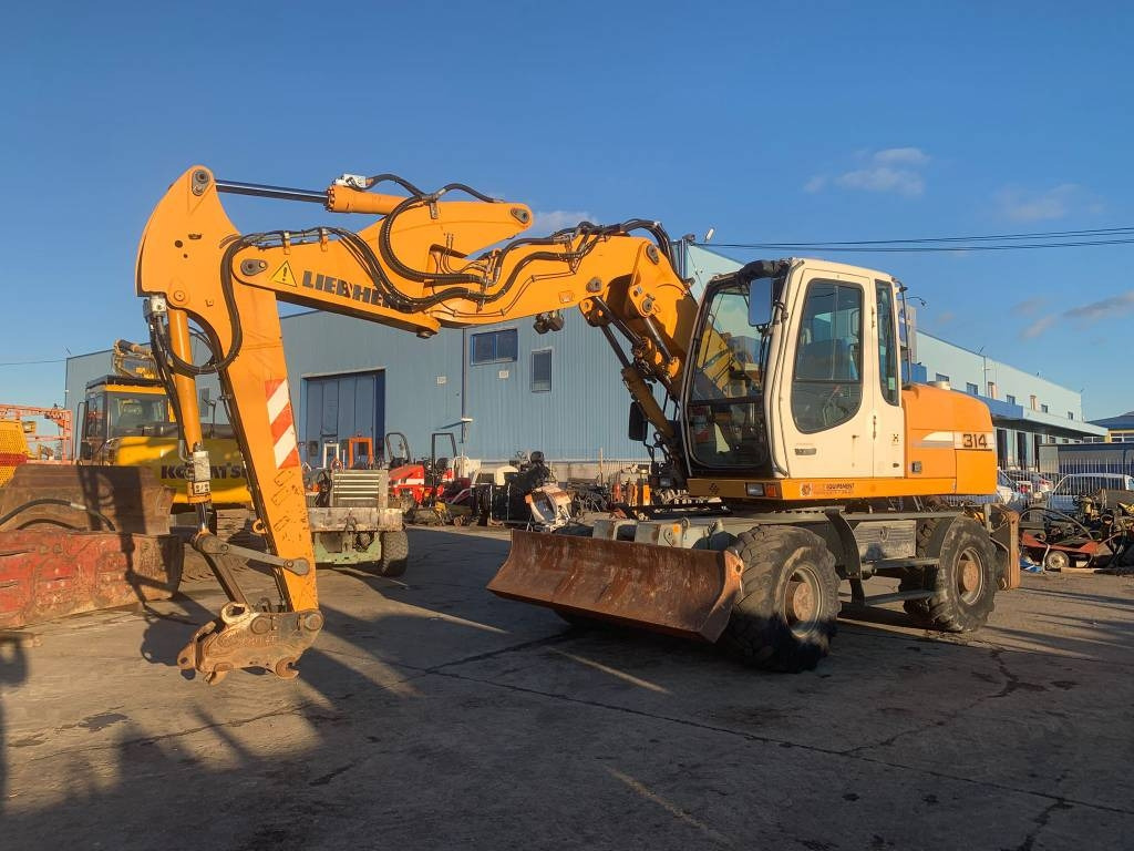 Liebherr A 314 Litronic - Riteņu ekskavators: foto 1 Liebherr A 314 Litronic - Riteņu ekskavators: foto 1