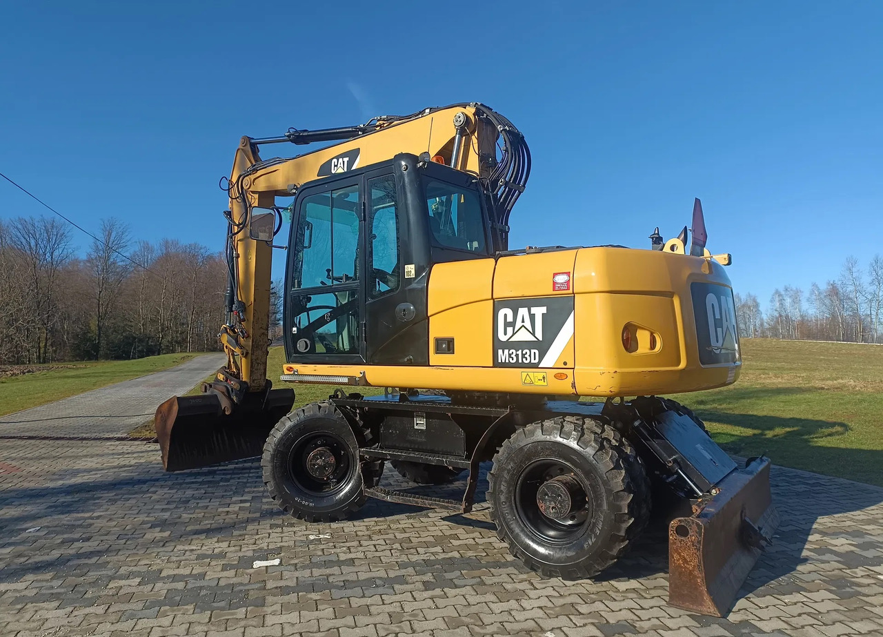 CATERPILLAR M313D - Riteņu ekskavators: foto 1 CATERPILLAR M313D - Riteņu ekskavators: foto 1