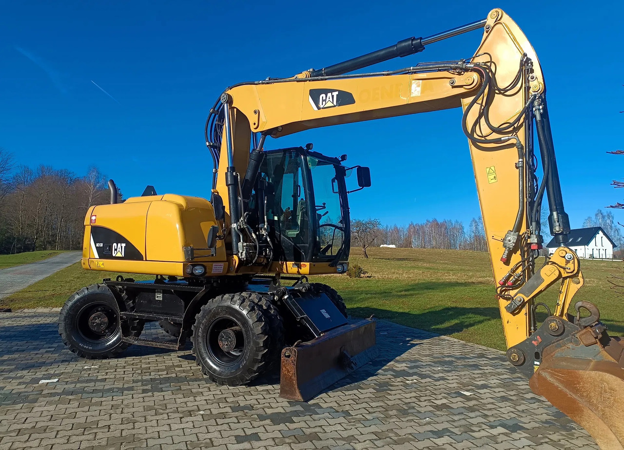CATERPILLAR M313D - Riteņu ekskavators: foto 2 CATERPILLAR M313D - Riteņu ekskavators: foto 2